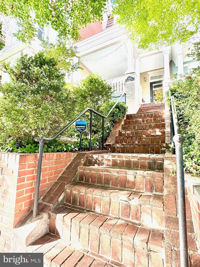 exterior space featuring brick siding