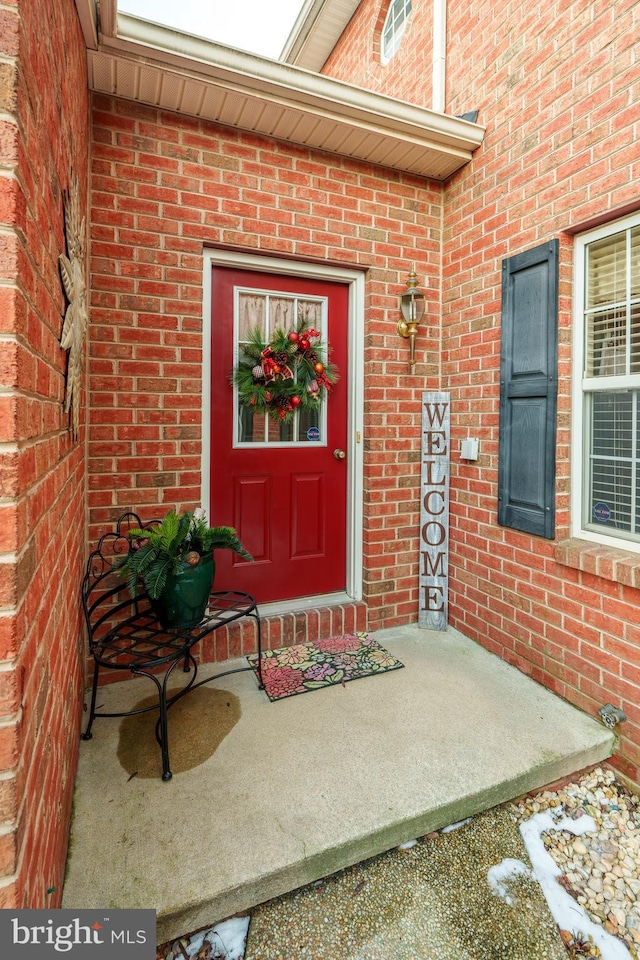 property entrance featuring a patio area