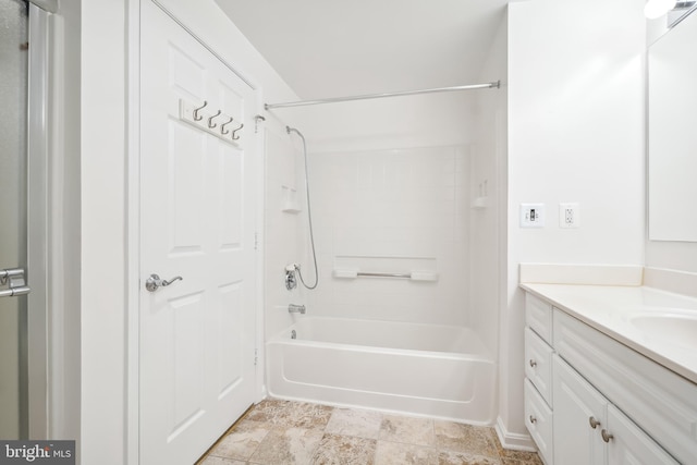 bathroom featuring bathing tub / shower combination and vanity