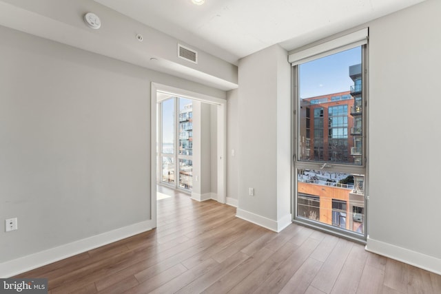 living room featuring hardwood / wood-style floors and plenty of natural light