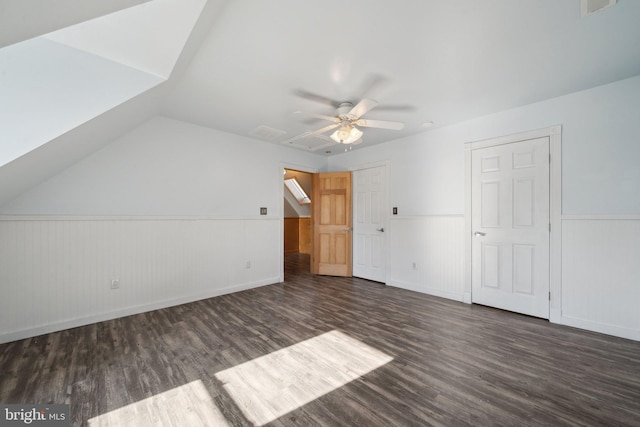 additional living space featuring ceiling fan, dark hardwood / wood-style flooring, and lofted ceiling