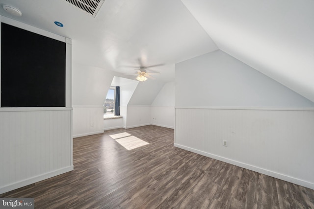 additional living space with ceiling fan, dark hardwood / wood-style floors, and lofted ceiling