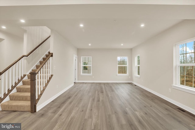 unfurnished living room with light wood-type flooring