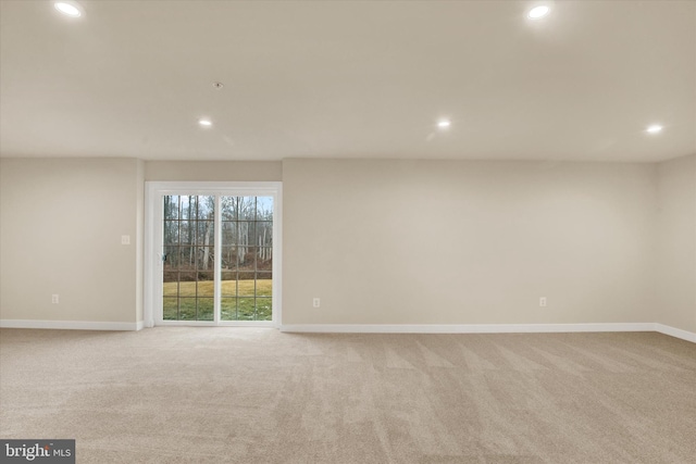 spare room with light colored carpet