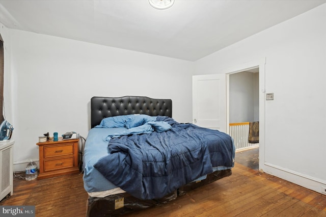 bedroom featuring dark hardwood / wood-style flooring