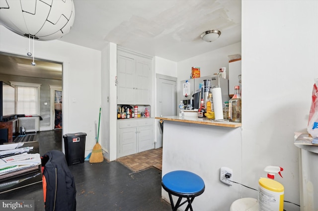 kitchen featuring white cabinetry and kitchen peninsula