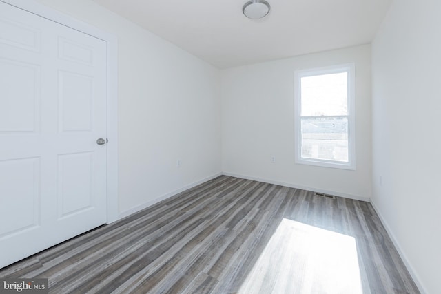 spare room featuring hardwood / wood-style floors