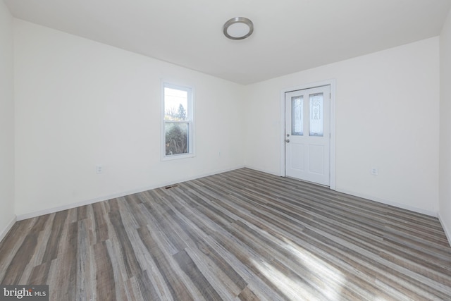 unfurnished room featuring hardwood / wood-style floors