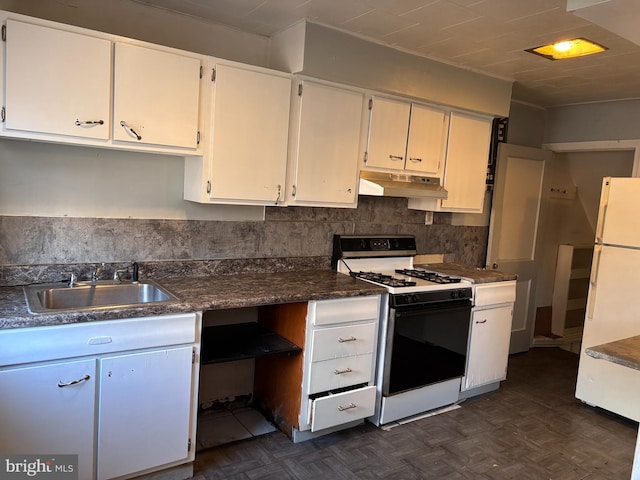 kitchen featuring sink, range with gas cooktop, dark parquet flooring, and white cabinetry