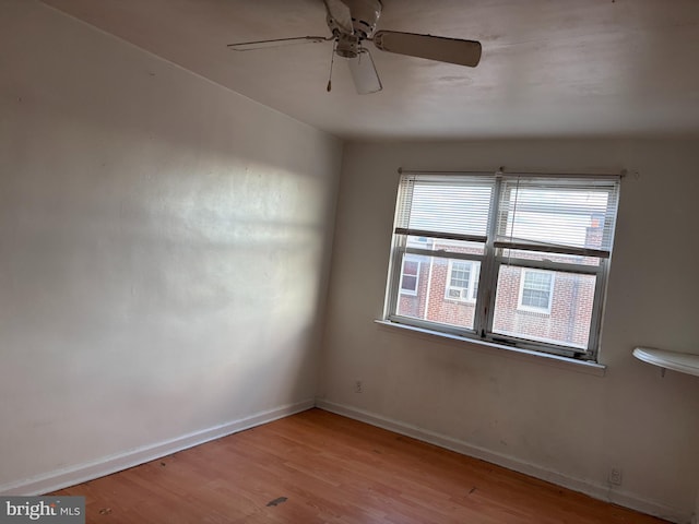 unfurnished room featuring light wood-type flooring and ceiling fan