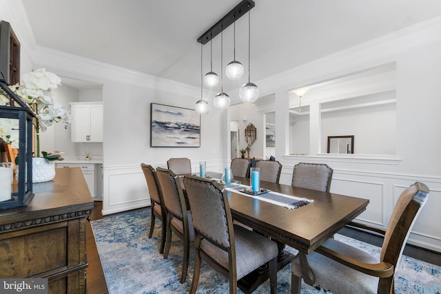 dining area with dark hardwood / wood-style flooring and ornamental molding