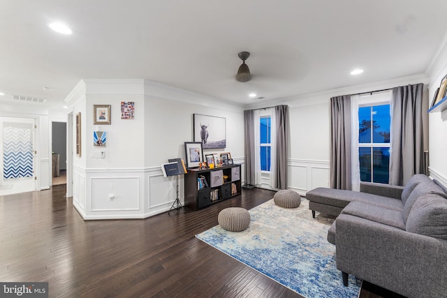 living room with ceiling fan, dark wood-type flooring, and crown molding