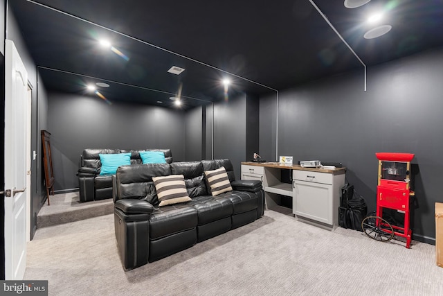 home theater room with light colored carpet