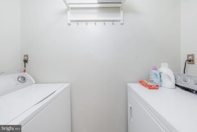 laundry area with washing machine and clothes dryer