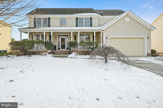 view of front of home featuring a porch and a garage