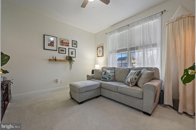 living room with ceiling fan and light carpet