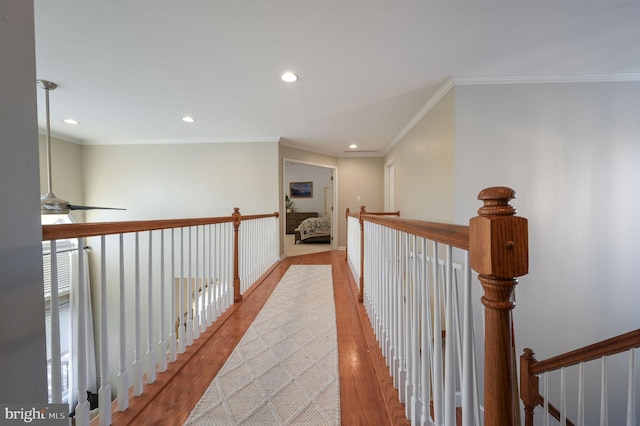 hall featuring light hardwood / wood-style flooring and crown molding