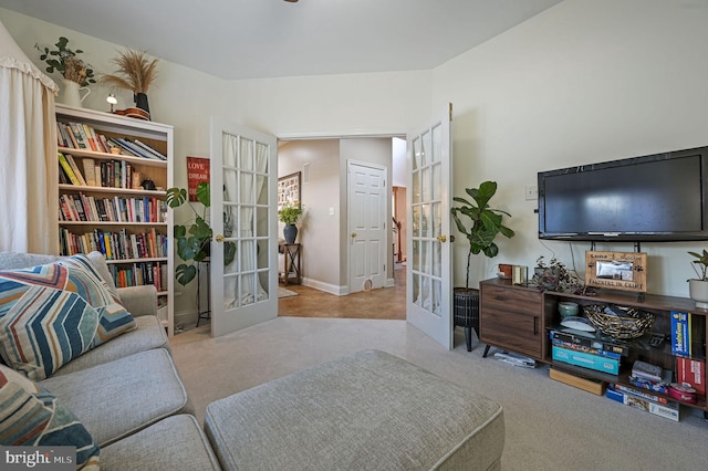 living room with light colored carpet and french doors