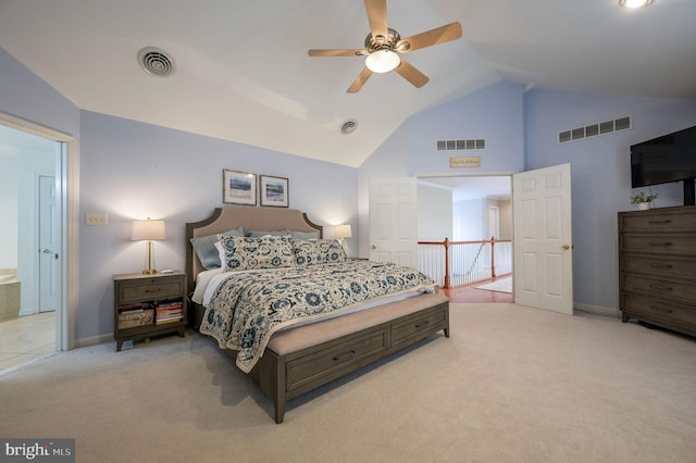 carpeted bedroom with ceiling fan, connected bathroom, and lofted ceiling