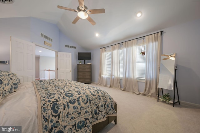 bedroom featuring lofted ceiling, ceiling fan, and light colored carpet