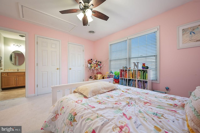 bedroom with ceiling fan and ensuite bath