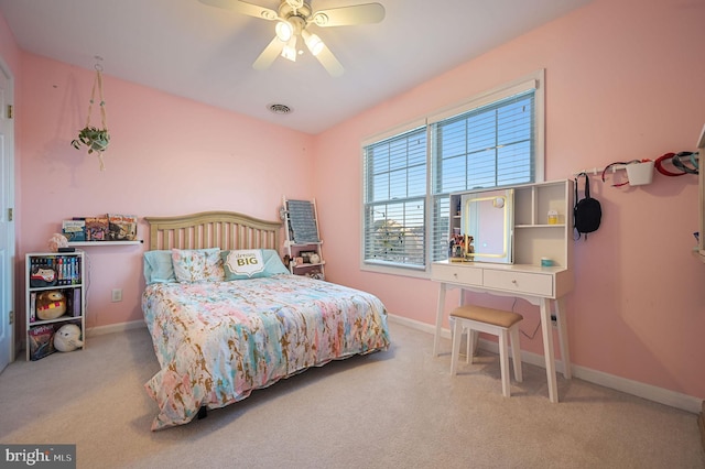 bedroom featuring ceiling fan and light carpet