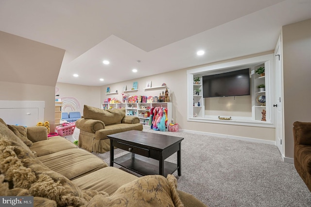 living room featuring carpet floors and built in features