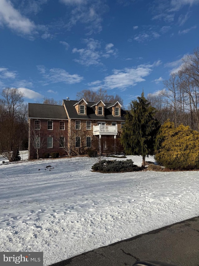 view of front of property with a balcony