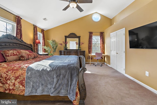 bedroom featuring lofted ceiling, a closet, a ceiling fan, carpet flooring, and baseboards