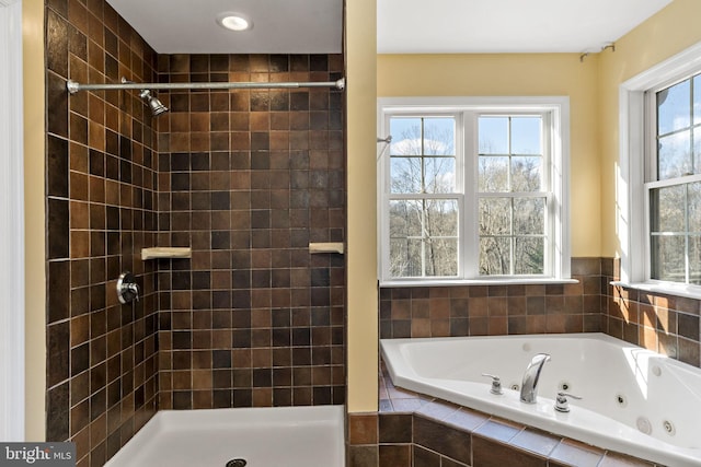 full bathroom featuring a stall shower and a jetted tub