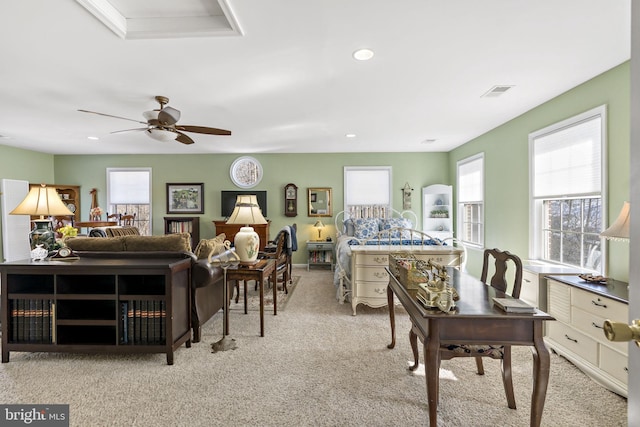 carpeted living room with visible vents, a ceiling fan, and recessed lighting