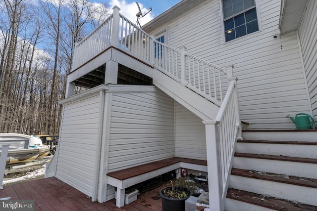 exterior space with stairway and a wooden deck