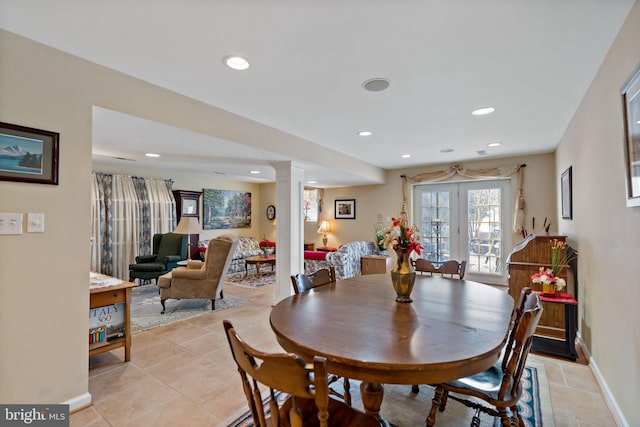 dining space with baseboards, light tile patterned floors, recessed lighting, and ornate columns