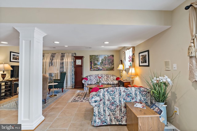 living room with recessed lighting, ornate columns, and light tile patterned floors