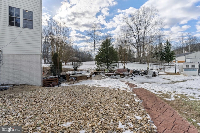 view of yard covered in snow