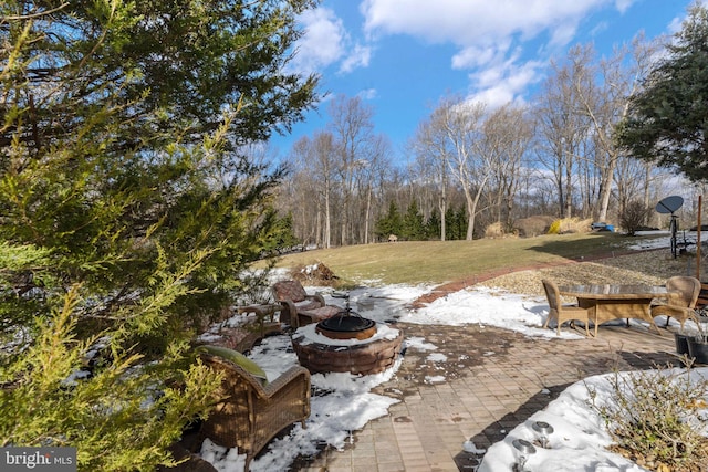 view of yard with a fire pit and a patio