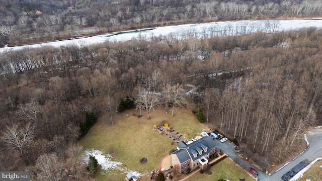 birds eye view of property with a wooded view