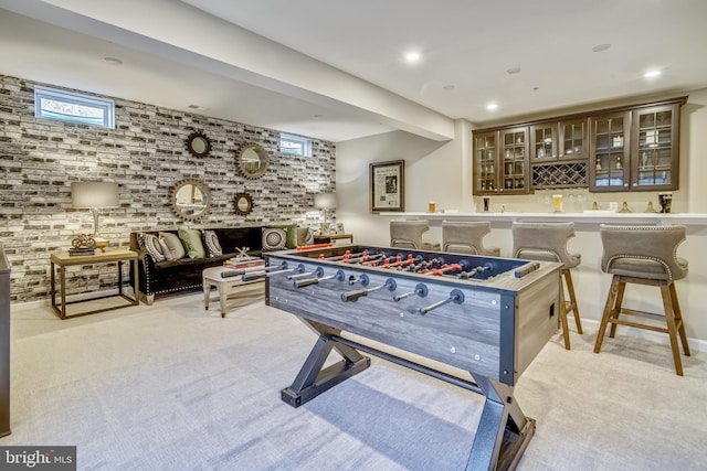 playroom with bar area and light colored carpet