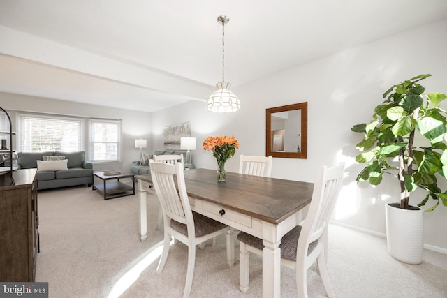 view of carpeted dining area