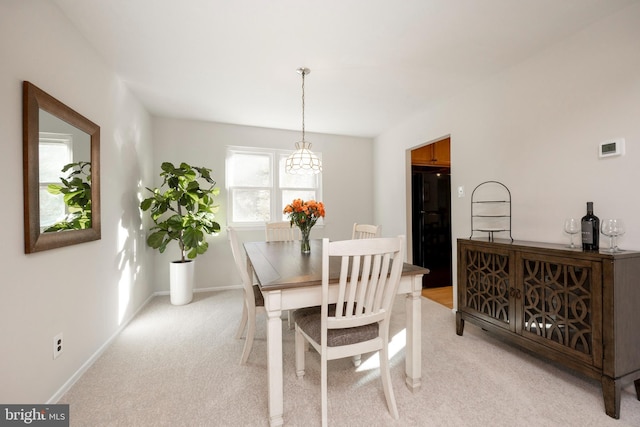 dining area with light colored carpet