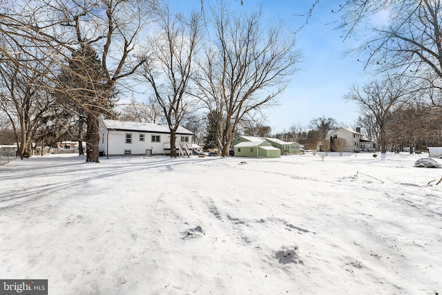 view of yard layered in snow