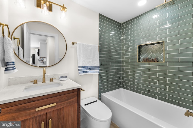 full bathroom with vanity, toilet, and tiled shower / bath combo