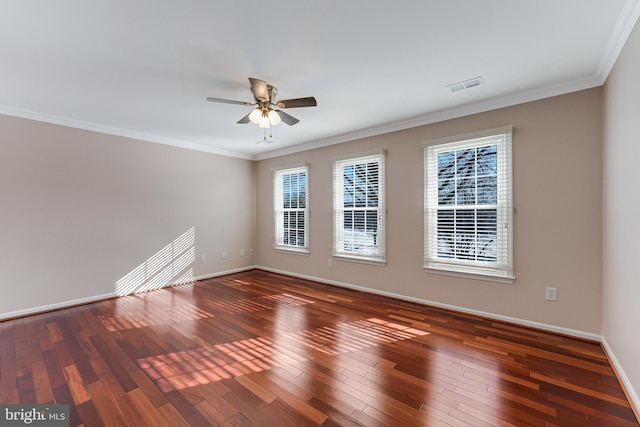 spare room with ceiling fan, ornamental molding, and dark hardwood / wood-style flooring