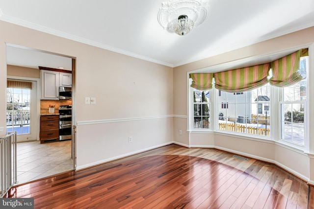 spare room featuring light wood-type flooring