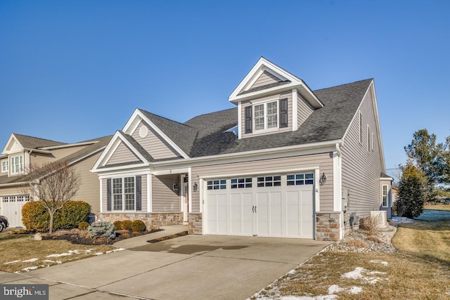 view of front of property with a front yard and a garage