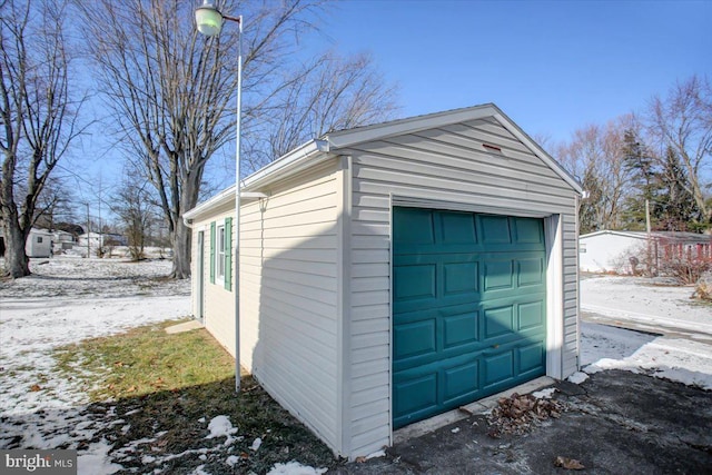 view of snow covered garage