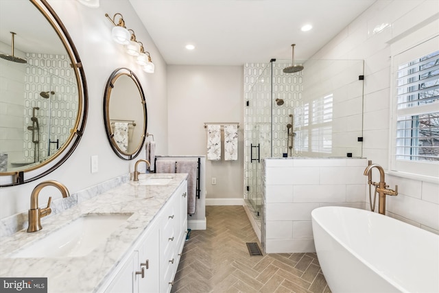 bathroom with vanity, separate shower and tub, and tile walls