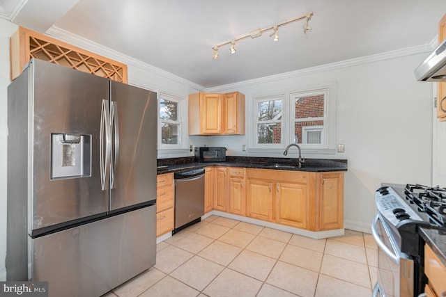 kitchen featuring stainless steel appliances, dark stone countertops, sink, light tile patterned flooring, and crown molding