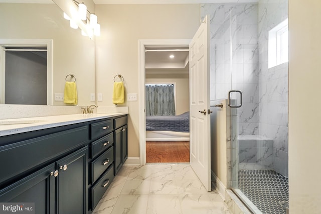 bathroom featuring vanity and a shower with shower door