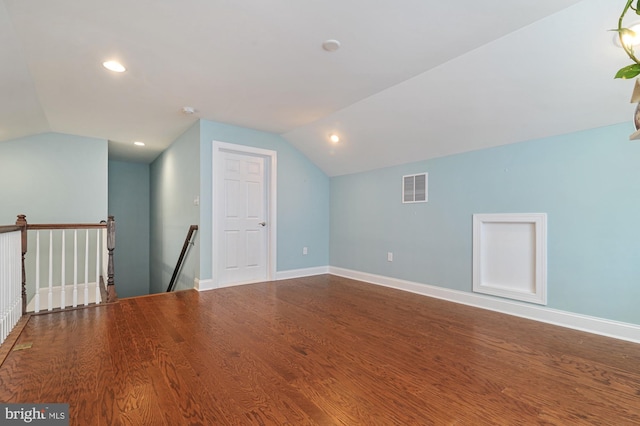 bonus room with lofted ceiling and hardwood / wood-style flooring